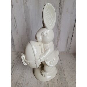 vintage Easter rabbit holding egg ceramic spring home decor figure